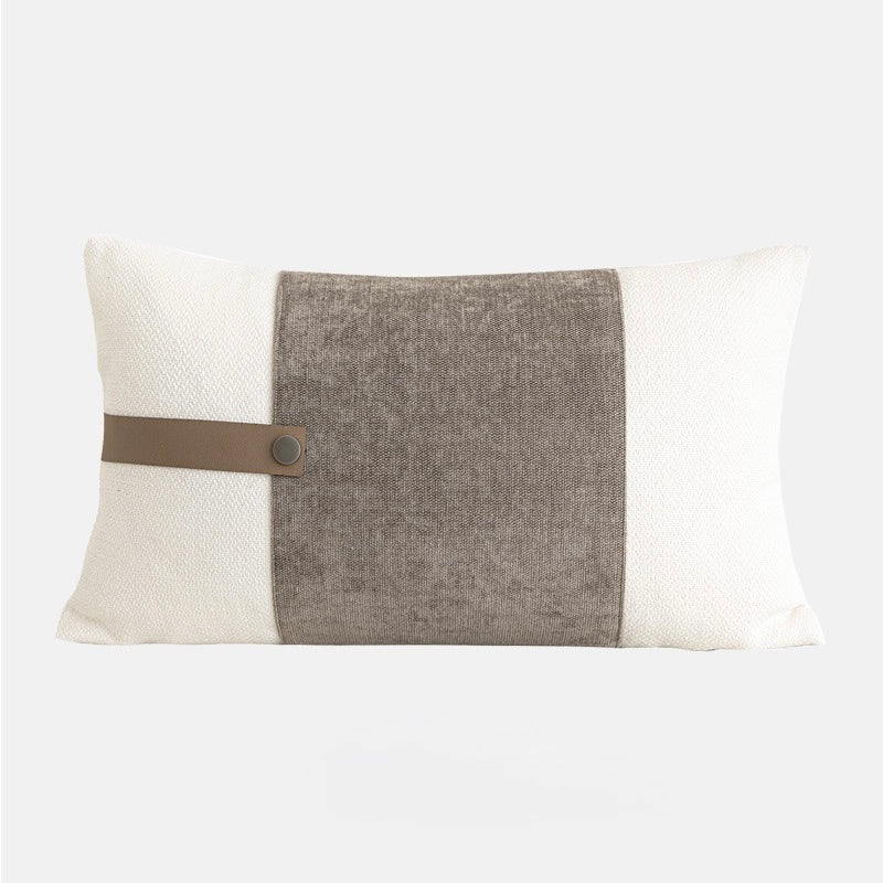 Rectangular decorative pillowcase with contrast fabric panel and minimalist strap detail.
