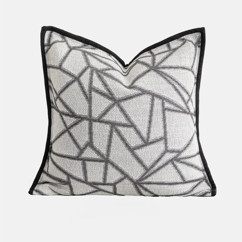 Square decorative pillowcase with abstract graphite line pattern and woven texture on neutral fabric.