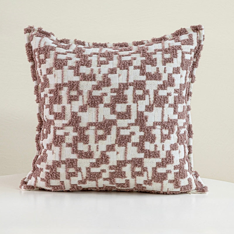 Square 45x45 cm accent pillow featuring a raised geometric tufted design in earthy taupe and cream tones.